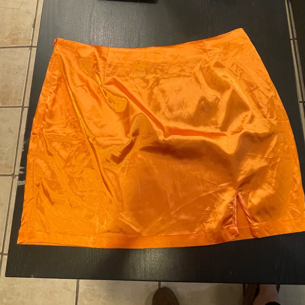 Bright orange satin skirt!